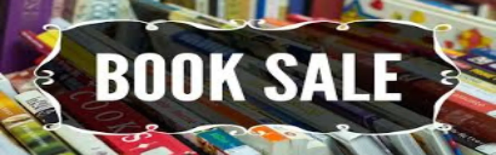 Book Sale sign with books in the background